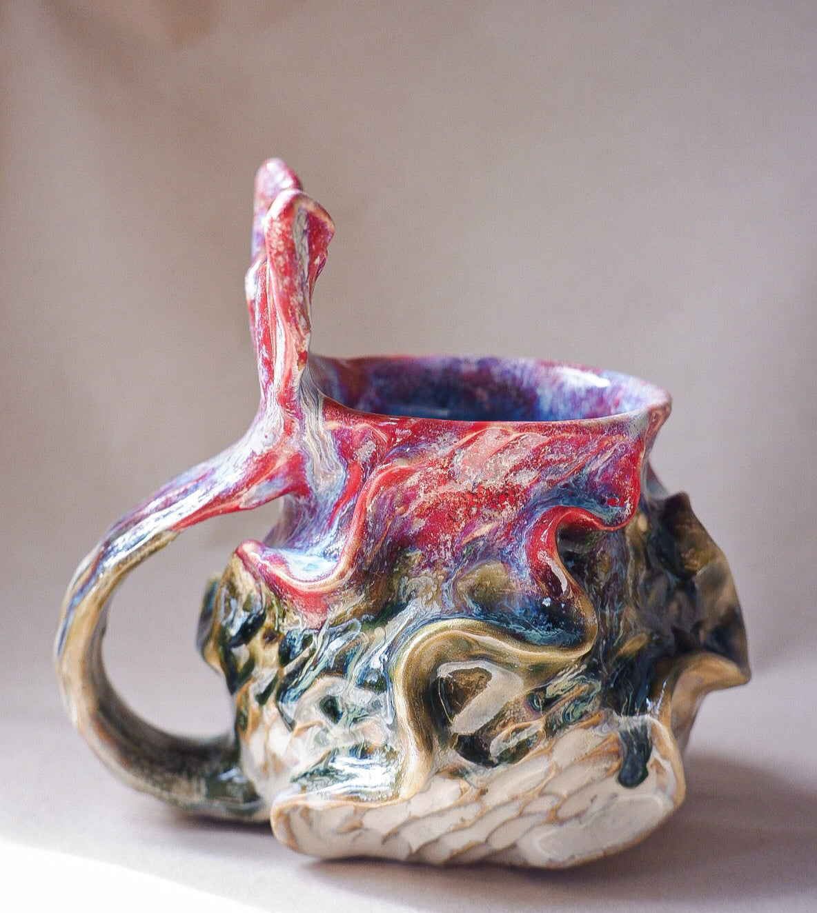 Handcrafted mermaid mug with a beautifully glazed finish, featuring a whimsical tail-shaped handle and ocean-inspired design, perfect for adding a touch of enchantment to your morning routine