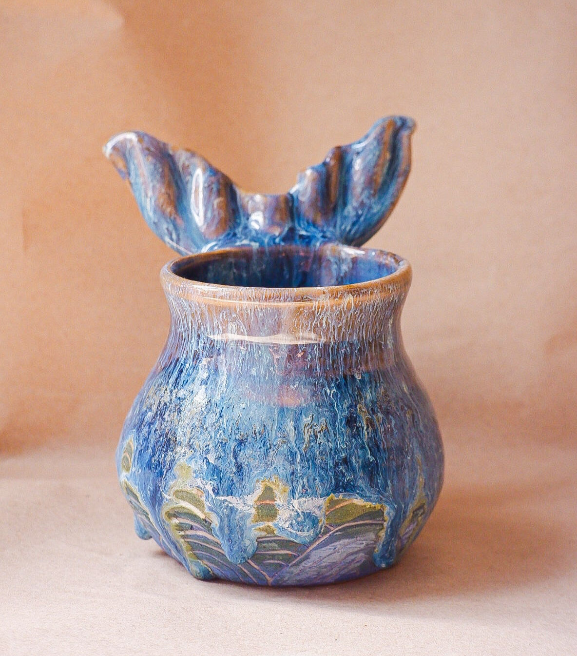 Handcrafted mermaid mug with a beautifully glazed finish, featuring a whimsical tail-shaped handle and ocean-inspired design, perfect for adding a touch of enchantment to your morning routine