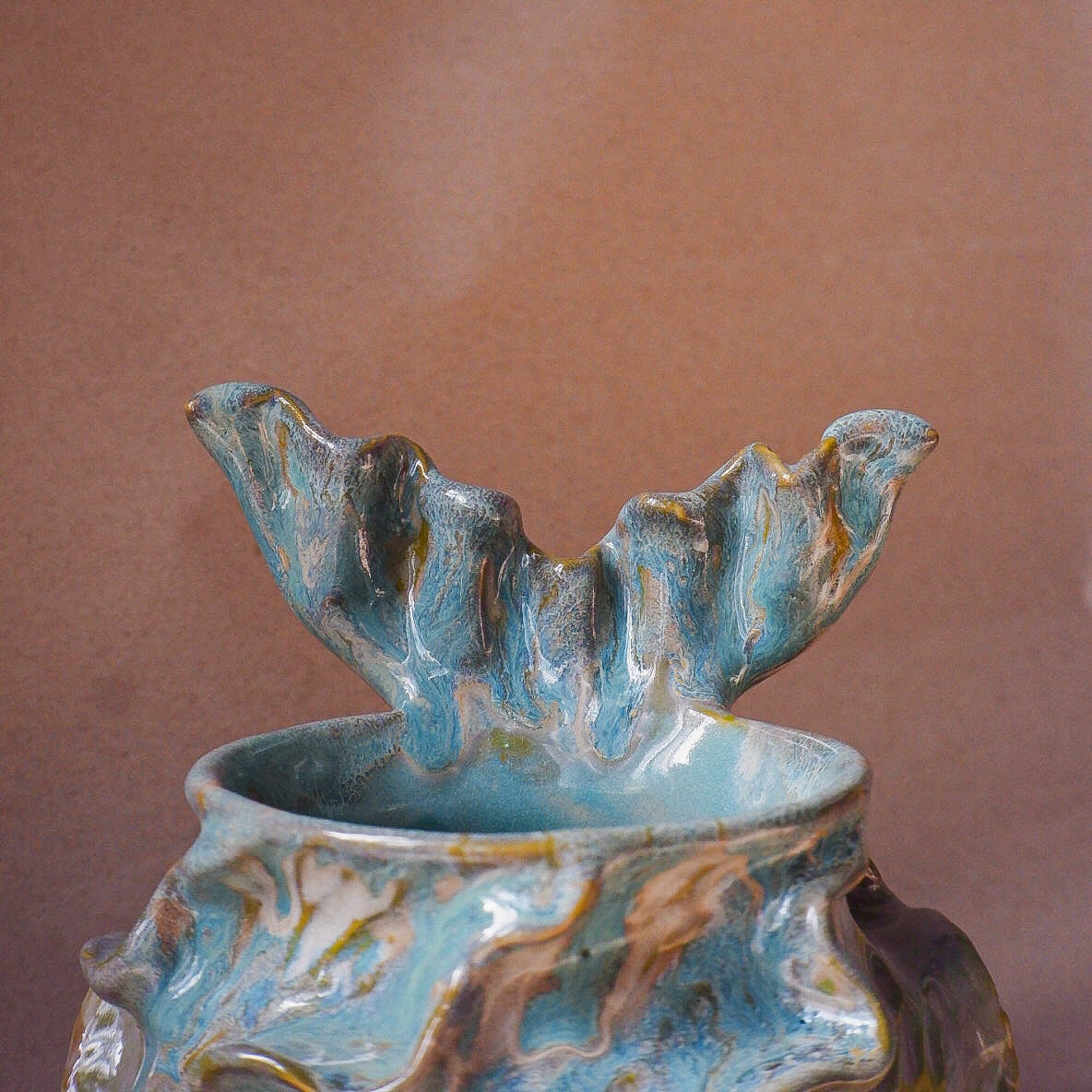 Handcrafted mermaid mug with a beautifully glazed finish, featuring a whimsical tail-shaped handle and ocean-inspired design, perfect for adding a touch of enchantment to your morning routine