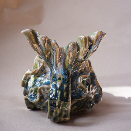 Handcrafted mermaid mug with a beautifully glazed finish, featuring a whimsical tail-shaped handle and ocean-inspired design, perfect for adding a touch of enchantment to your morning routine