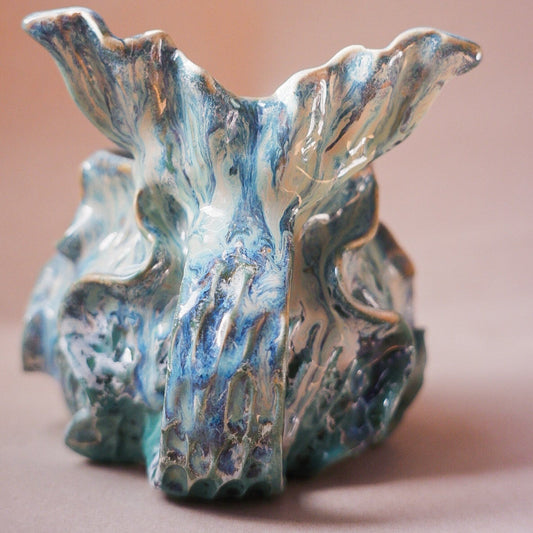 Handcrafted mermaid mug with a beautifully glazed finish, featuring a whimsical tail-shaped handle and ocean-inspired design, perfect for adding a touch of enchantment to your morning routine