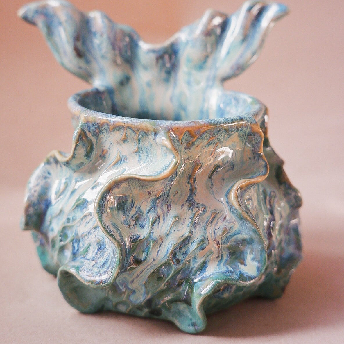 Handcrafted mermaid mug with a beautifully glazed finish, featuring a whimsical tail-shaped handle and ocean-inspired design, perfect for adding a touch of enchantment to your morning routine