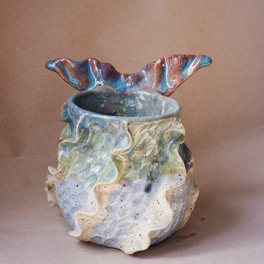 Handcrafted mermaid mug with a beautifully glazed finish, featuring a whimsical tail-shaped handle and ocean-inspired design, perfect for adding a touch of enchantment to your morning routine