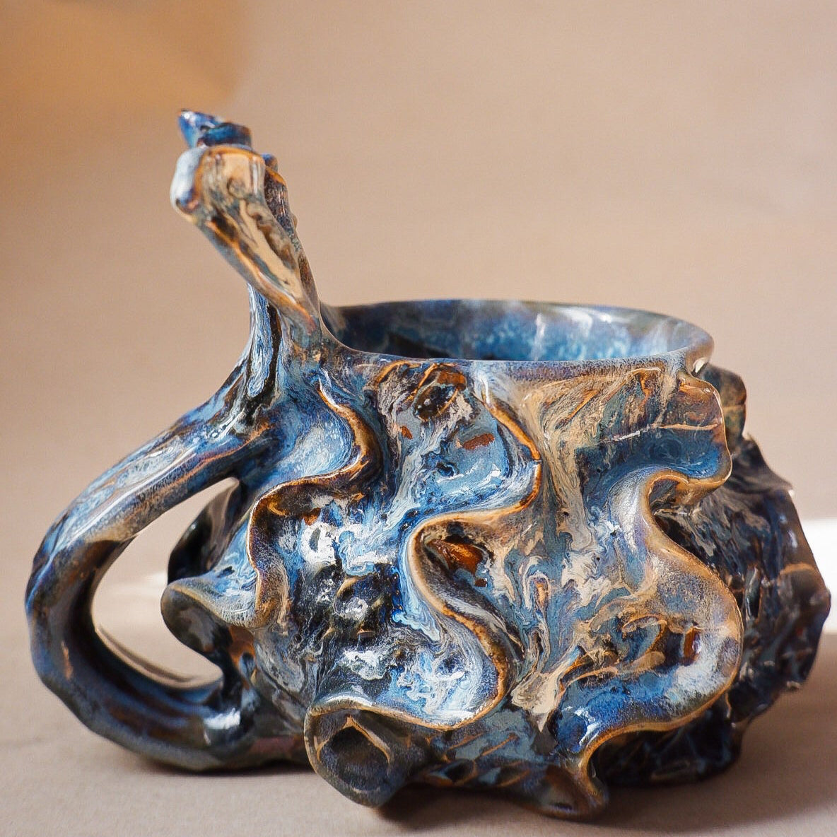Handcrafted mermaid mug with a beautifully glazed finish, featuring a whimsical tail-shaped handle and ocean-inspired design, perfect for adding a touch of enchantment to your morning routine