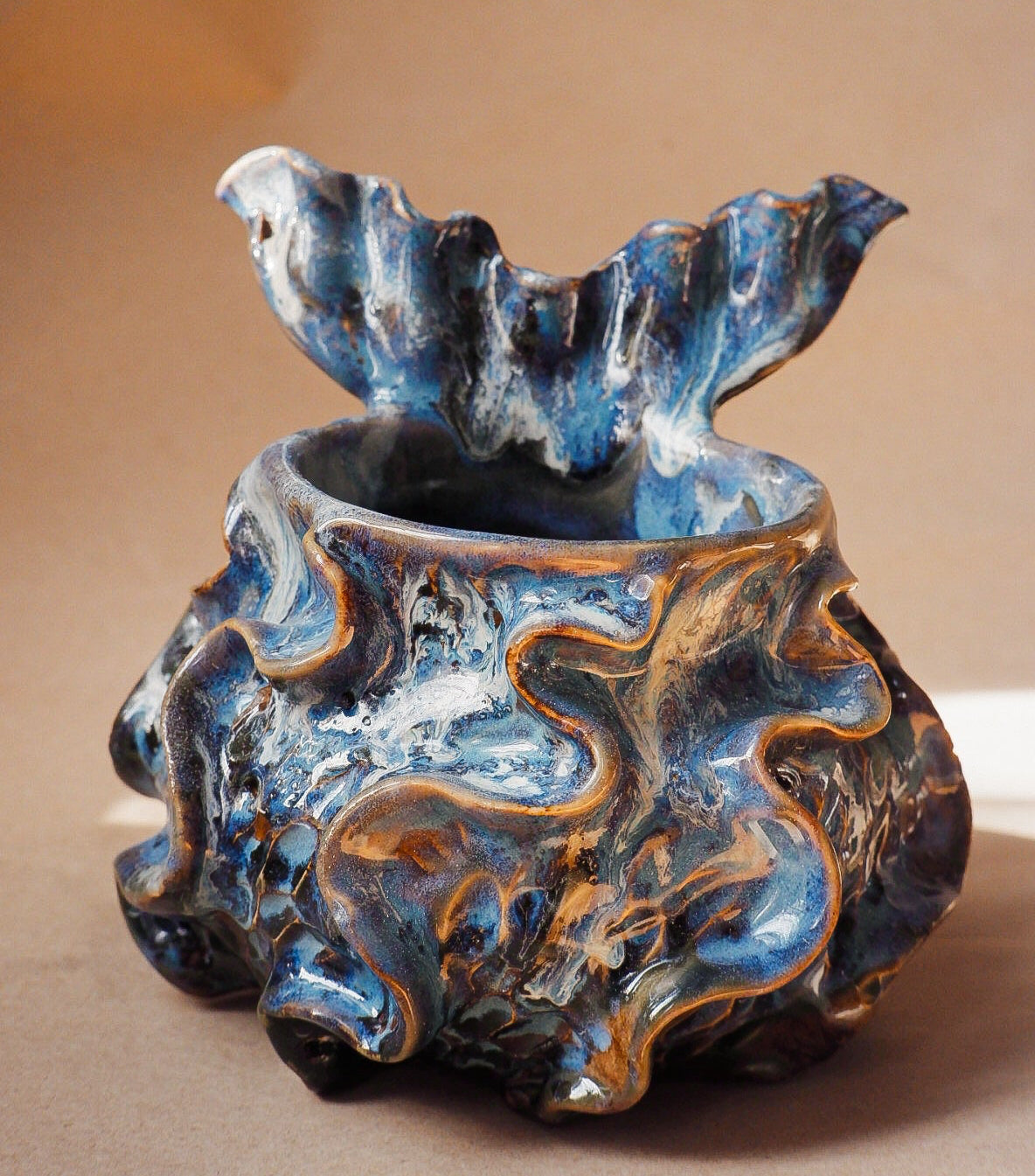Handcrafted mermaid mug with a beautifully glazed finish, featuring a whimsical tail-shaped handle and ocean-inspired design, perfect for adding a touch of enchantment to your morning routine