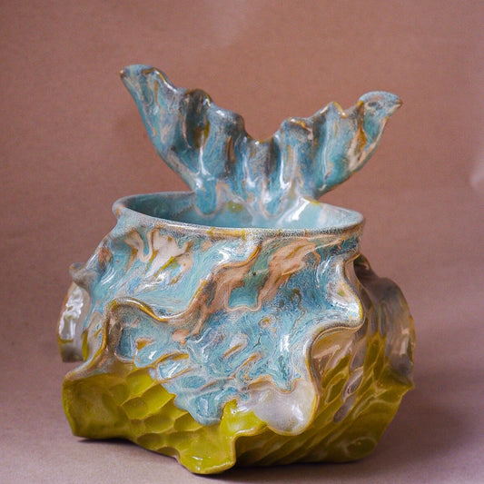 Handcrafted mermaid mug with a beautifully glazed finish, featuring a whimsical tail-shaped handle and ocean-inspired design, perfect for adding a touch of enchantment to your morning routine