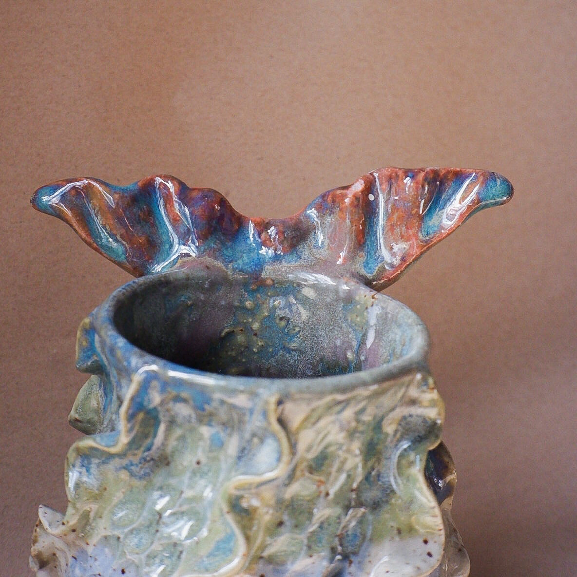 Handcrafted mermaid mug with a beautifully glazed finish, featuring a whimsical tail-shaped handle and ocean-inspired design, perfect for adding a touch of enchantment to your morning routine