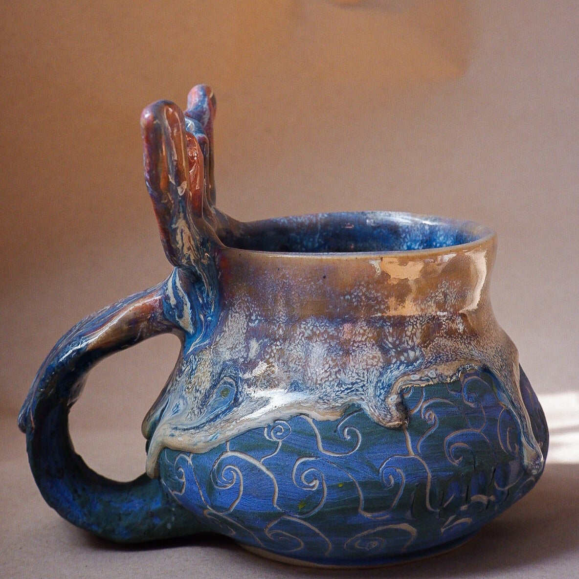Handcrafted mermaid mug with a beautifully glazed finish, featuring a whimsical tail-shaped handle and ocean-inspired design, perfect for adding a touch of enchantment to your morning routine