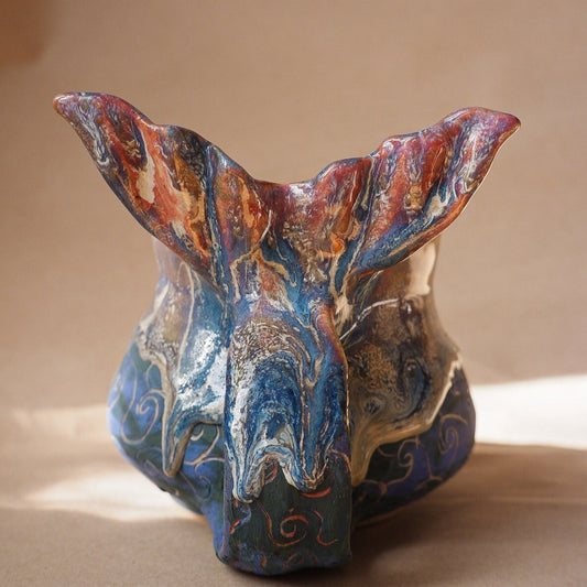 Handcrafted mermaid mug with a beautifully glazed finish, featuring a whimsical tail-shaped handle and ocean-inspired design, perfect for adding a touch of enchantment to your morning routine