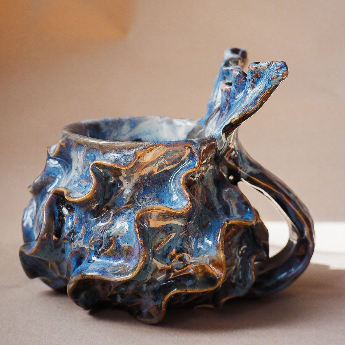 Handcrafted mermaid mug with a beautifully glazed finish, featuring a whimsical tail-shaped handle and ocean-inspired design, perfect for adding a touch of enchantment to your morning routine
