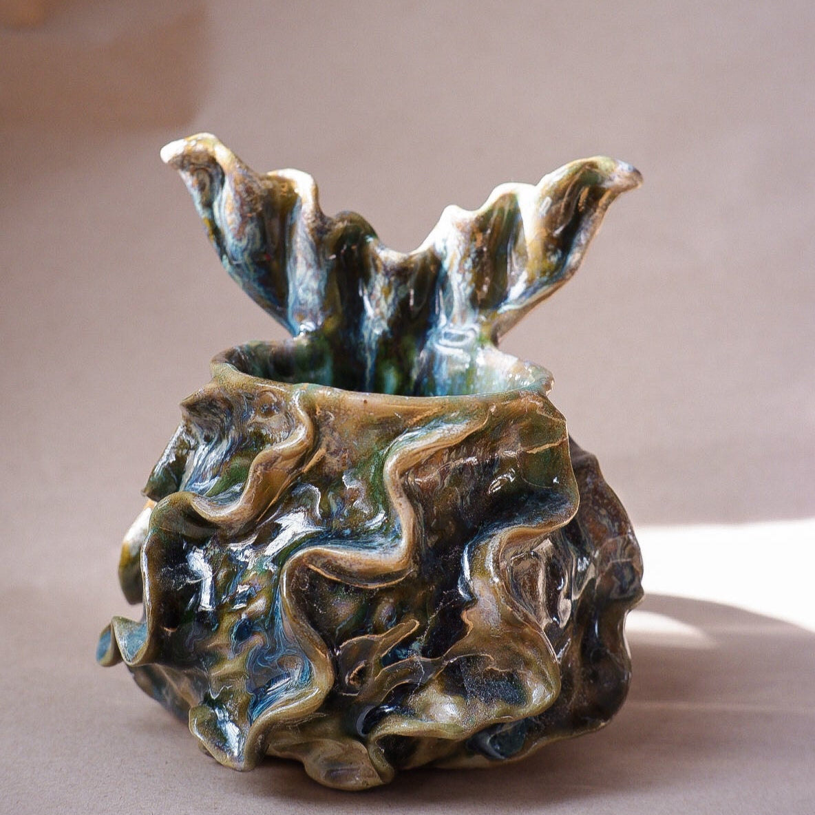 Handcrafted mermaid mug with a beautifully glazed finish, featuring a whimsical tail-shaped handle and ocean-inspired design, perfect for adding a touch of enchantment to your morning routine