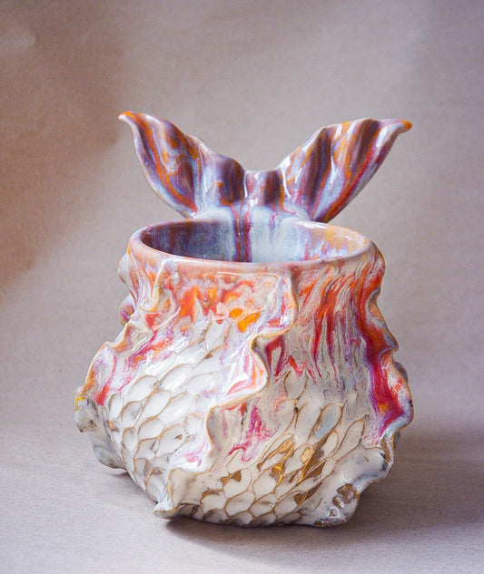 Handcrafted mermaid mug with a beautifully glazed finish, featuring a whimsical tail-shaped handle and ocean-inspired design, perfect for adding a touch of enchantment to your morning routine