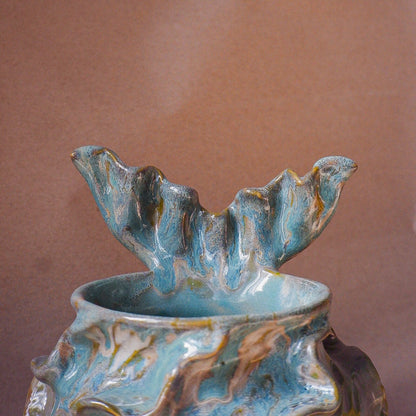 Handcrafted mermaid mug with a beautifully glazed finish, featuring a whimsical tail-shaped handle and ocean-inspired design, perfect for adding a touch of enchantment to your morning routine