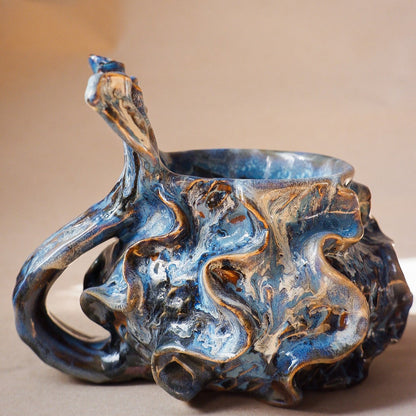 Handcrafted mermaid mug with a beautifully glazed finish, featuring a whimsical tail-shaped handle and ocean-inspired design, perfect for adding a touch of enchantment to your morning routine