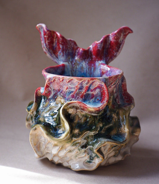 Handcrafted mermaid mug with a beautifully glazed finish, featuring a whimsical tail-shaped handle and ocean-inspired design, perfect for adding a touch of enchantment to your morning routine