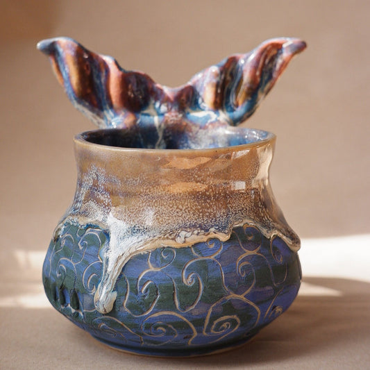 Handcrafted mermaid mug with a beautifully glazed finish, featuring a whimsical tail-shaped handle and ocean-inspired design, perfect for adding a touch of enchantment to your morning routine