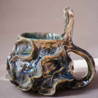 Handcrafted mermaid mug with a beautifully glazed finish, featuring a whimsical tail-shaped handle and ocean-inspired design, perfect for adding a touch of enchantment to your morning routine