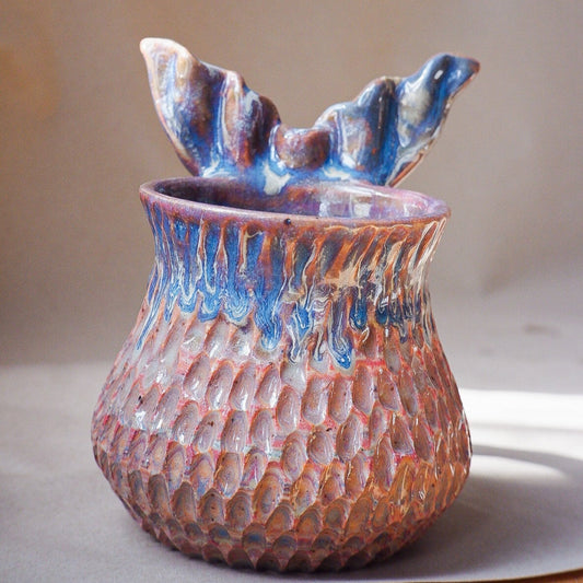 Handcrafted mermaid mug with a beautifully glazed finish, featuring a whimsical tail-shaped handle and ocean-inspired design, perfect for adding a touch of enchantment to your morning routine